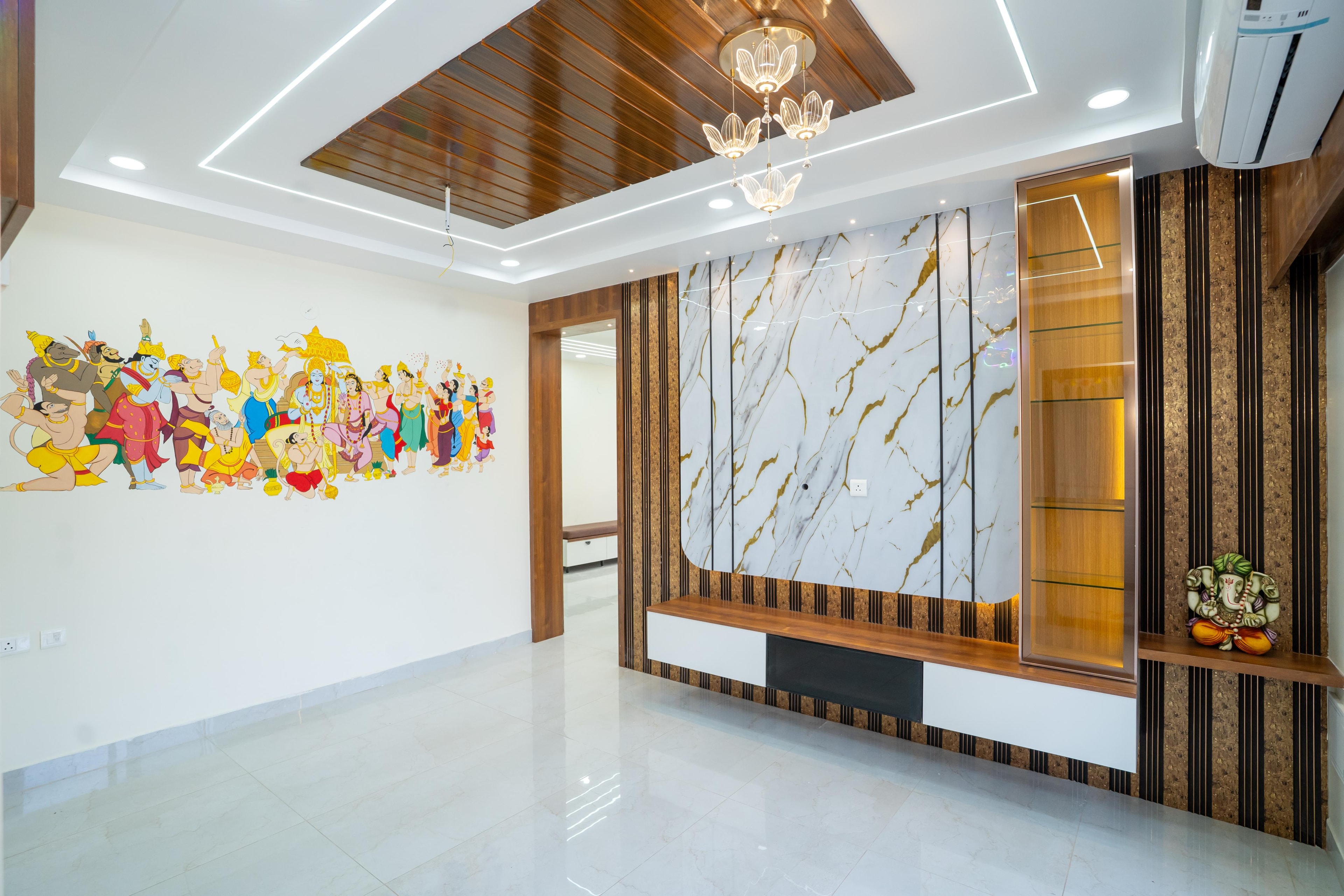 Luxury living room interior designed by Navrish Interiors featuring warm walnut wood paneling, architectural ceiling lighting, and custom woodwork in a Hyderabad villa